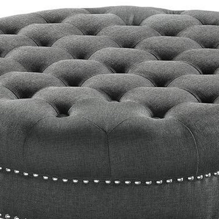 Fabric Upholstered Round Tufted Ottoman with Wood Legs, Gray and Black