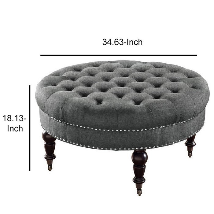 Fabric Upholstered Round Tufted Ottoman with Wood Legs, Gray and Black