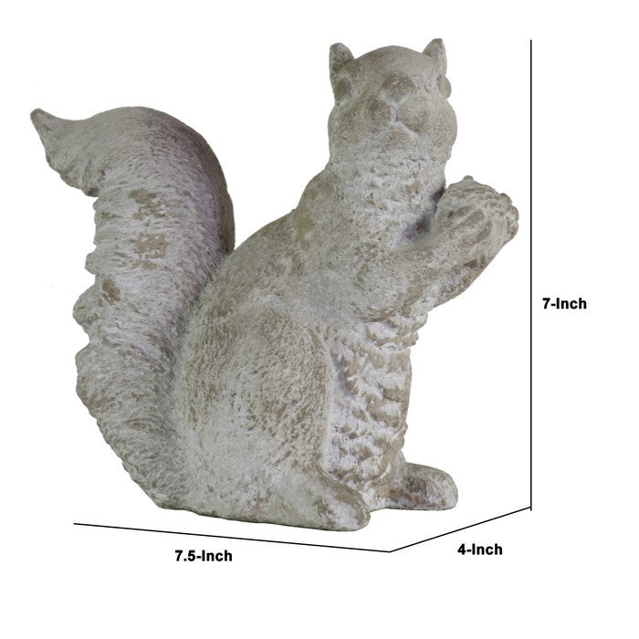 Cement Figurine of Squirrel Sitting Sideways and Holding a Nut, Gray